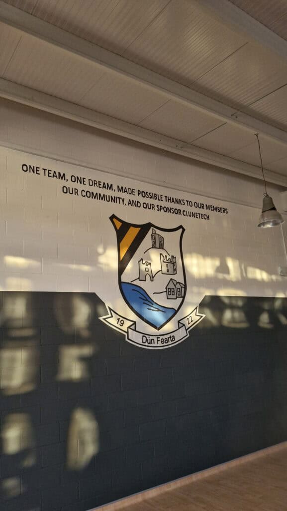 Sports club crest and slogan on interior wall